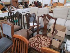 A carver chair and 3 dining chairs