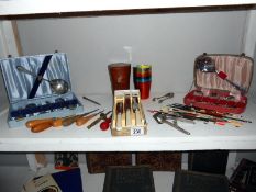 A mixed lot including cased cutlery, fishing floats,