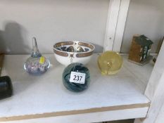 A Scottish highland bowl and 3 paperweights