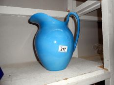 A large blue pottery ewer