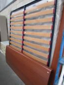 A 6ft wooden bedstead with mattress