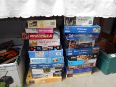 A quantity of jigsaw puzzles etc