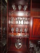 A glass vase and 3 sets of glasses