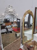 A metal framed mirror and a gilt framed mirror