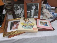 An Elvis book and Elvis framed pictures