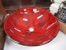 A large coloured glass vessel sink