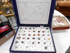 A boxed collection of gemstones and a boxed collection of butterflies and moths