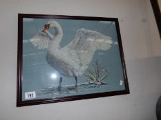 A framed and glazed tapestry of a swan