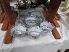 6 oriental rice bowls with spoons and a plate