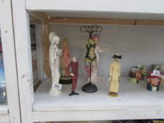 A jewellery stand figure and 5 other figures