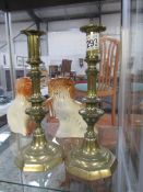 A pair of brass candlesticks