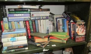 A shelf of books including biography