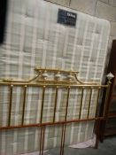 A Myers Continental Comfort mattress and brass headboard