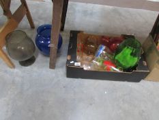 A box of coloured glassware