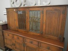 A good quality oak Priory style dresser