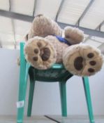 A teddy bear on chair