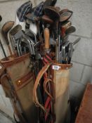 A quantity of old golf clubs