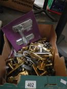 A quantity of door handles including brass