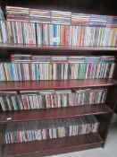 In excess of 300 CD's of various music genres on 4 shelves