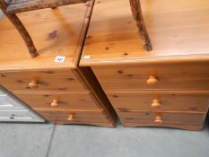 A pair of 3 drawer pine bedsides