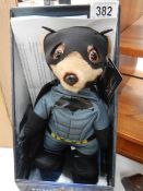 A limited edition Meercat movies batman toy with papers