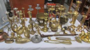 A mixed lot of brass and copper ware including candlesticks