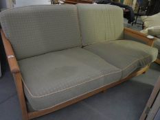 A wood framed sofa and chair