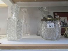 A quantity of decanters and a biscuit barrel