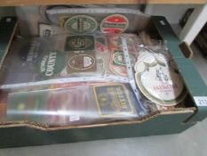 A box of beer mats, Guinness,