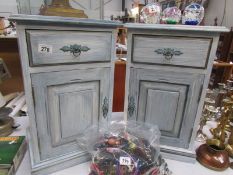 A pair of painted bedside cabinets