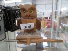 A carved wood owl inkwell with pen,