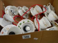 A quantity of tea cup and saucer ceiling lights,