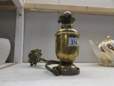 A brass gimbal oil lamp