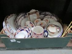 A box of assorted dinner ware