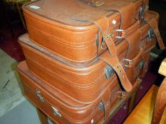 A suitcase stand & 3 suitcases
