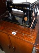 A Singer cabinet sewing machine