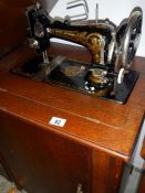 A Frister Rossman cabinet sewing machine