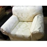 A cream Bracade armchair