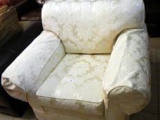 A cream Bracade armchair