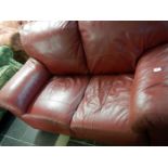 A red leather 2 seater settee