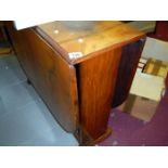 A walnut drop leaf table