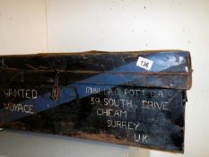 A metal shipping trunk