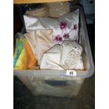 A box of linen & cushions etc.