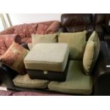 A 2 seater leather settee & pouffe
