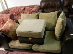 A 2 seater leather settee & pouffe