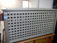 A lattice linen bin