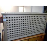 A lattice linen bin