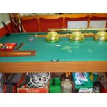 A pool table, cues, balls & lights etc.