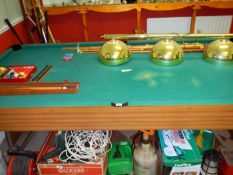 A pool table, cues, balls & lights etc.