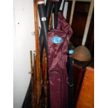 A large quantity of fishing rods & bank sticks etc
